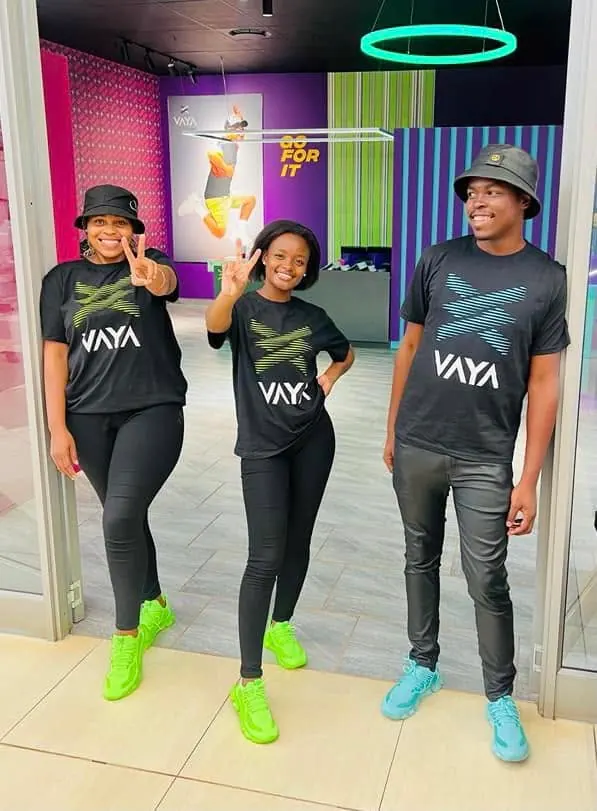 Three VAYA wearers showing their colourful sneakers together