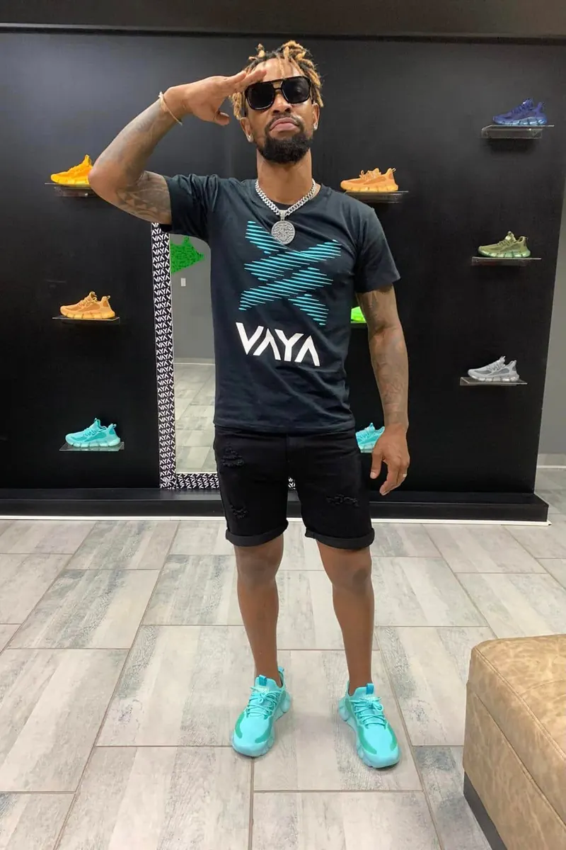 VAYA Sky Blue sneakers and a VAYA T-shirt worn in store