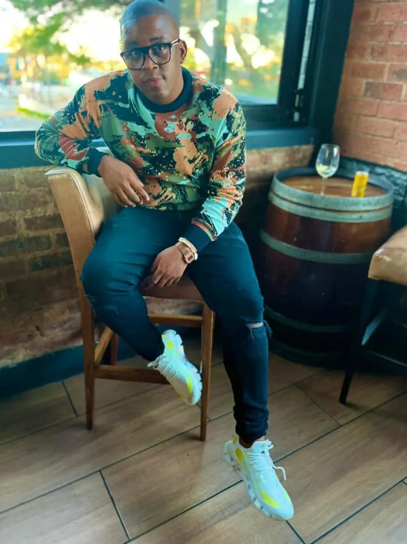 VAYA Sky Blue sneakers worn with a colourful shirt