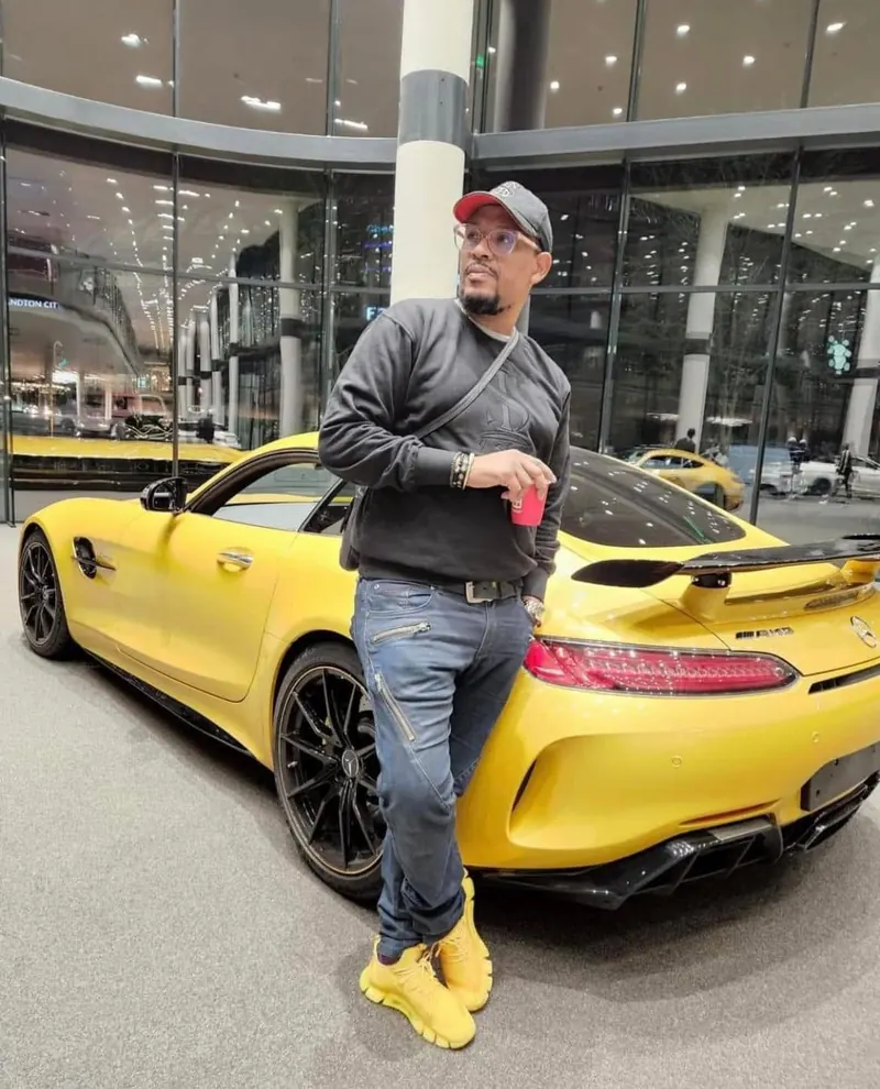 VAYA Mustard sneakers worn beside a yellow car