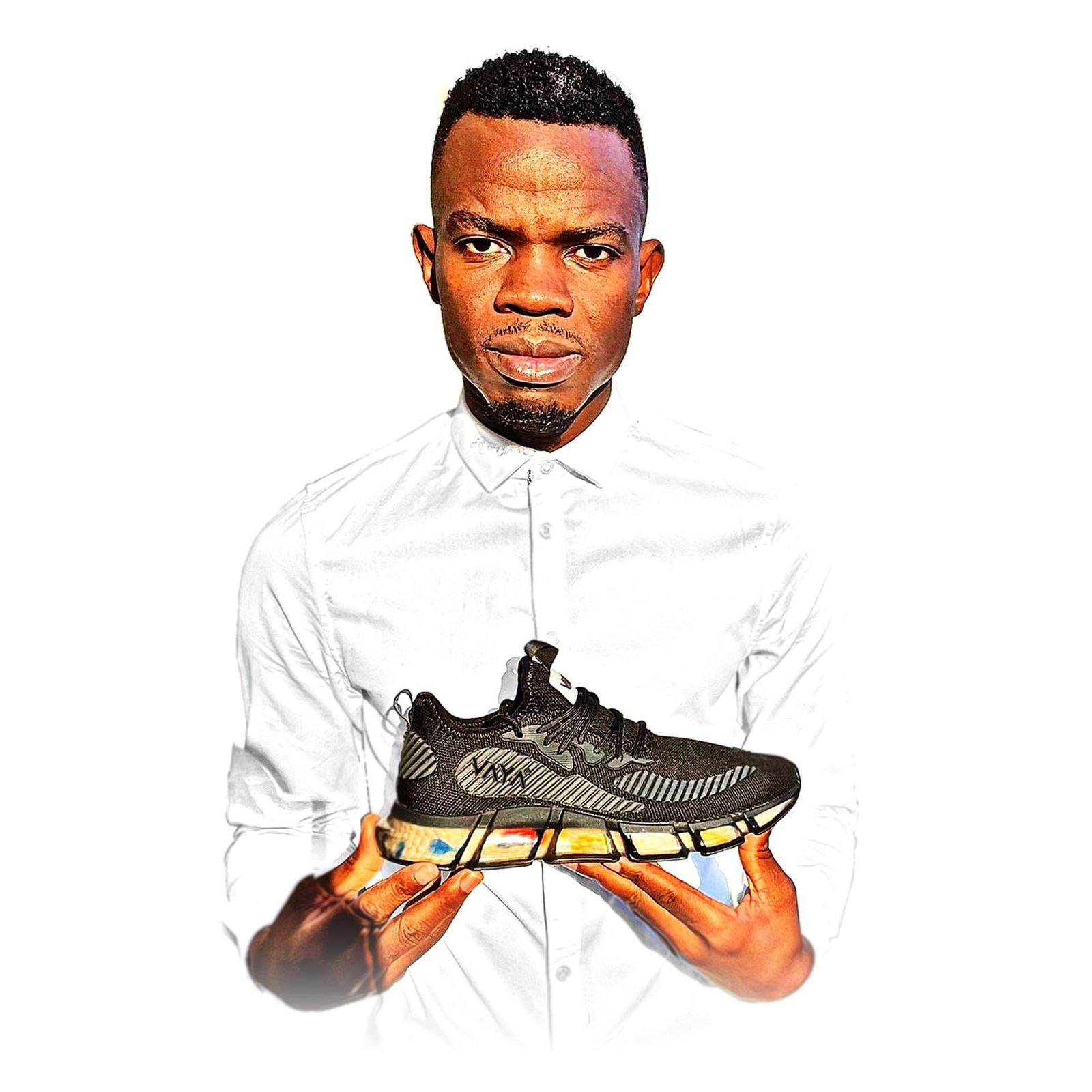 VAYA founder Themba Makamo holding a VAYA Triumph sneaker