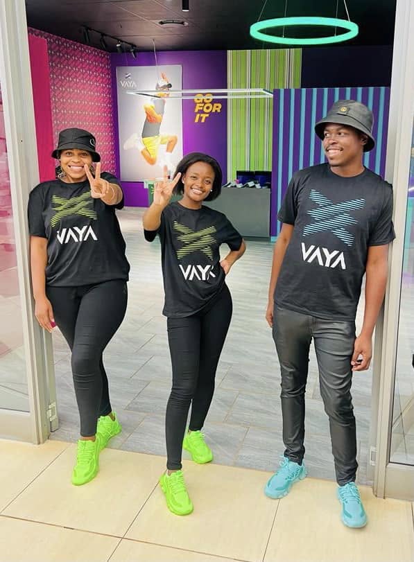 Three VAYA wearers showing their colourful sneakers together
